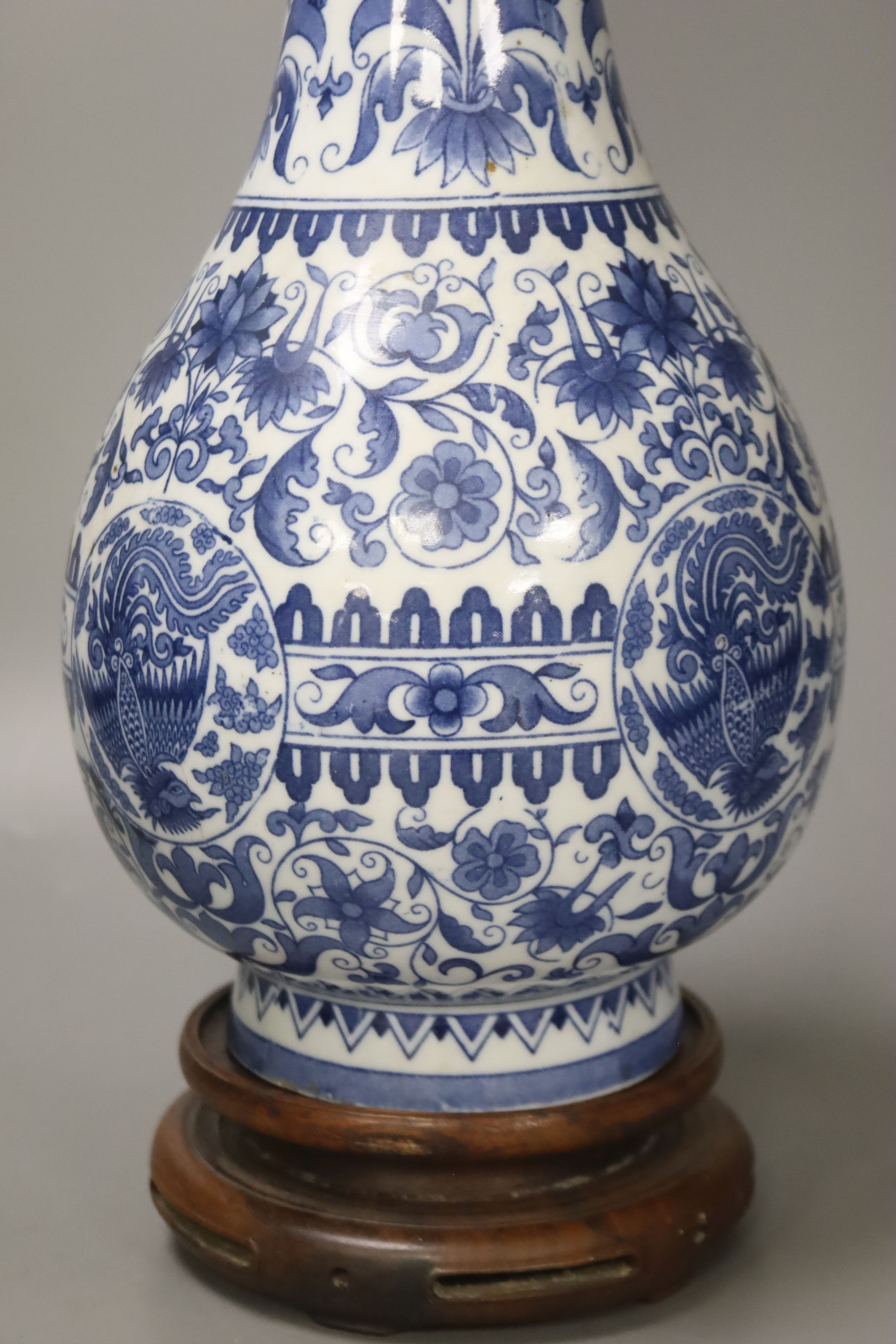 A Dutch porcelain blue and white long necked bottle vase